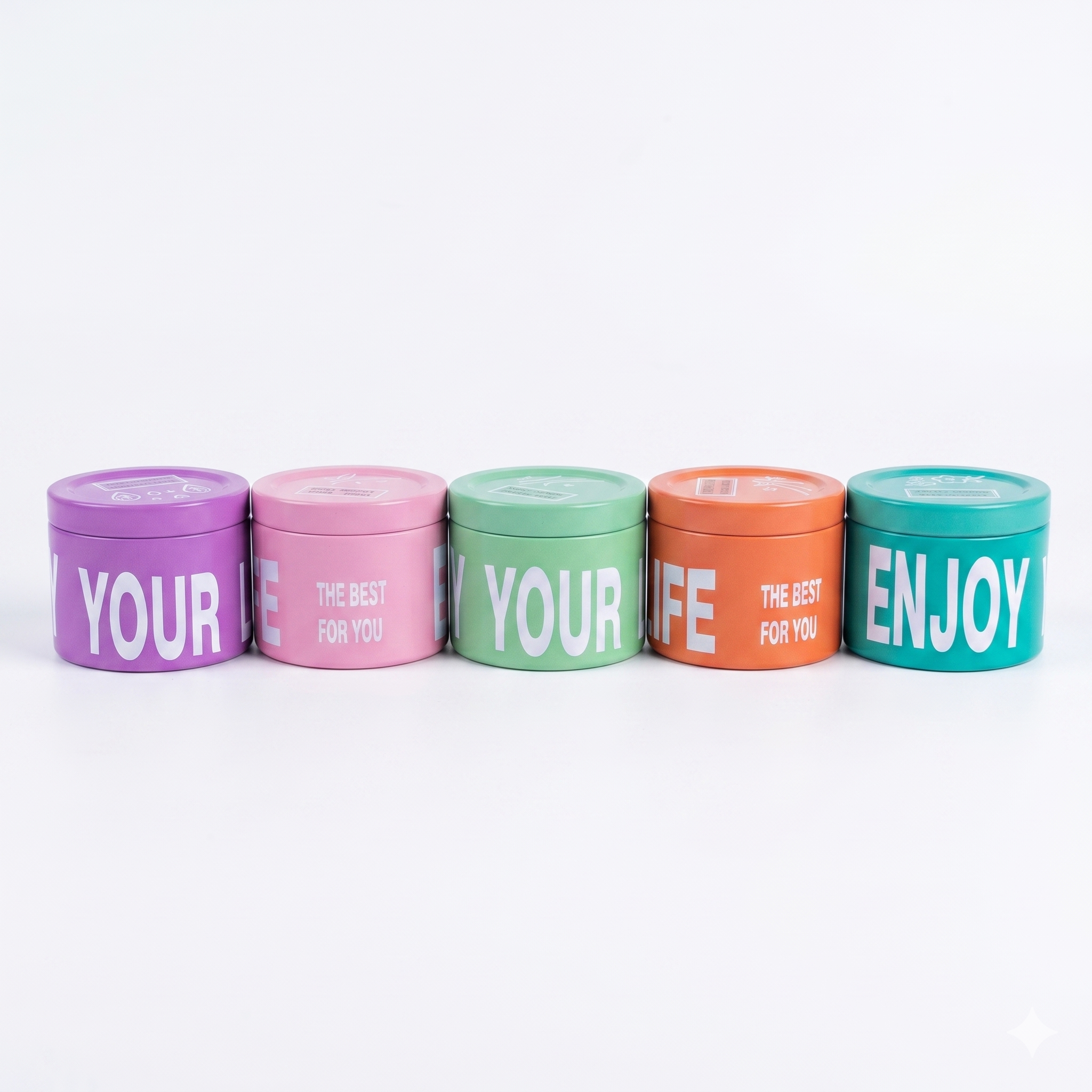 شموع عطرية فواحة في عبوات معدنية ملونة (Enjoy Your Life Collection).