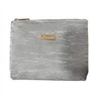 Silver velvet makeup pouch with a gold Daasis logo plate and zipper closure on a white background.