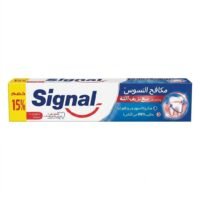 Home Signal Cavity Fighter toothpaste box in white and blue, featuring a red smile logo, an illustrated tooth graphic, and a yellow promotional band on the left showing a 15% discount.